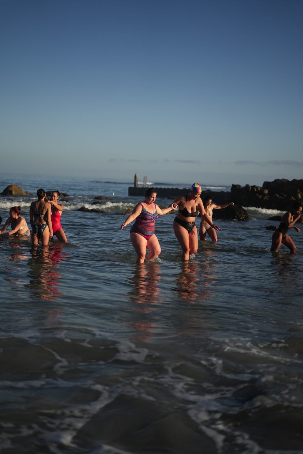 Cold plunge into the ocean at sunset