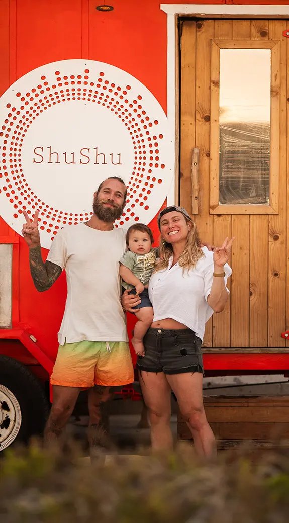 Jari, Mix and their child in front of the red ShuShu sauna
